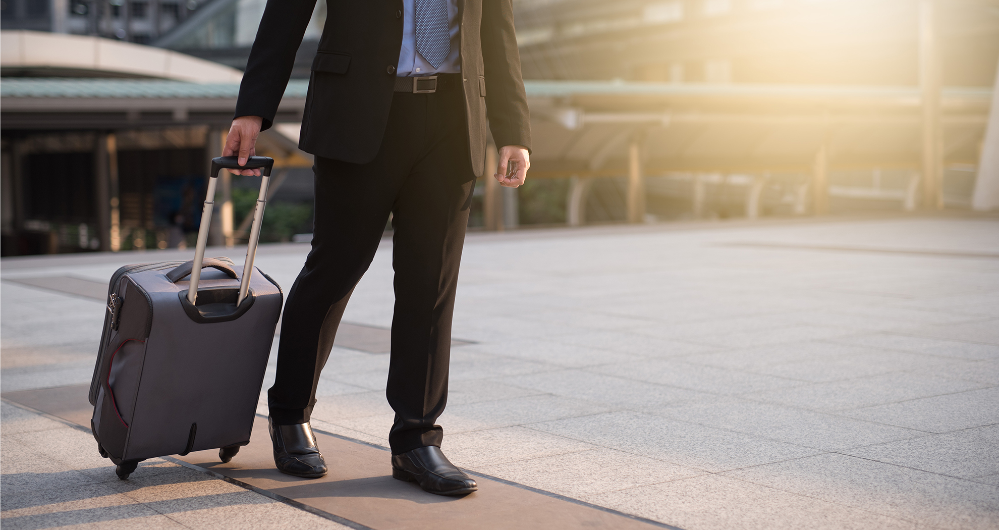 man walking with a suitcase