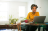 Man sitting at his latop in an office
