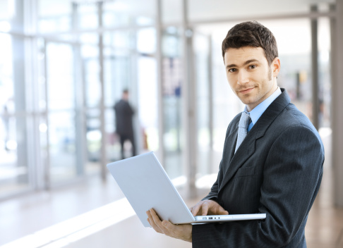 man holding a laptop