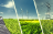 fields with solar panel, windmill and power lines