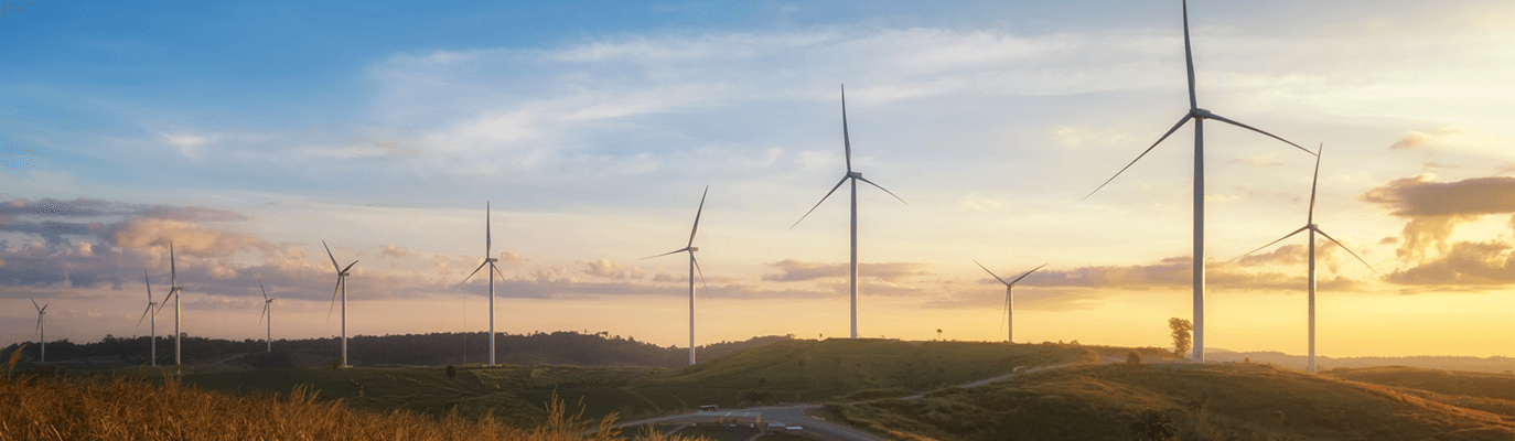 View of wind turbine in a field at twilight