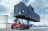 Crane lifting large shipping container