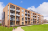 New buld apartment block with lawn in foreground