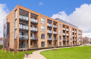 New buld apartment block with lawn in foreground