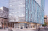 Glass building with people in the foreground