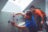 Two men installing wall tiles.