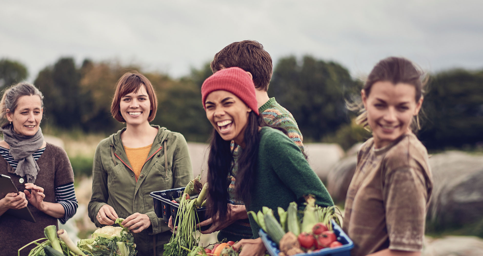  A community of women together outside at an AIB charity event.
